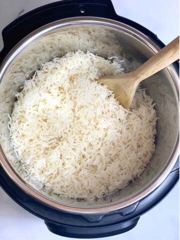 perfectly cooked rice with a ladle