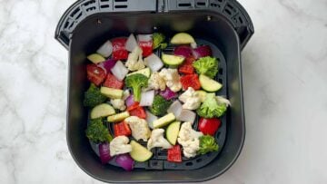 step to add seasoned mixed vegetable in the air fryer basket