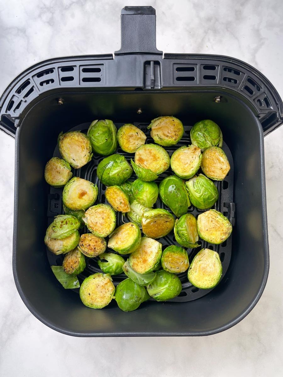 step to add seasoned sprouts in to the air fryer basket 