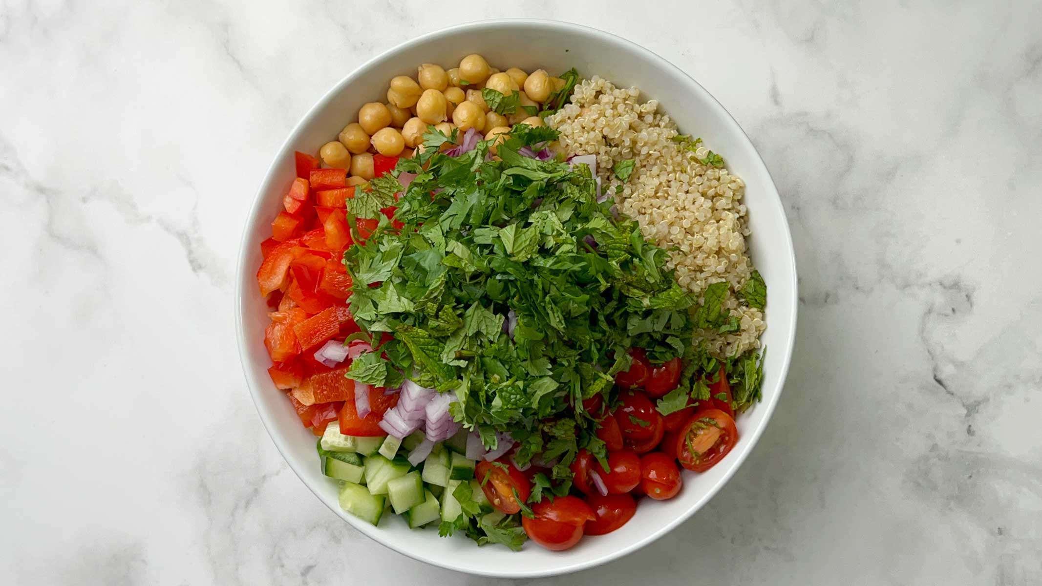 step to plave all the salad ingredients in a mixing bowl