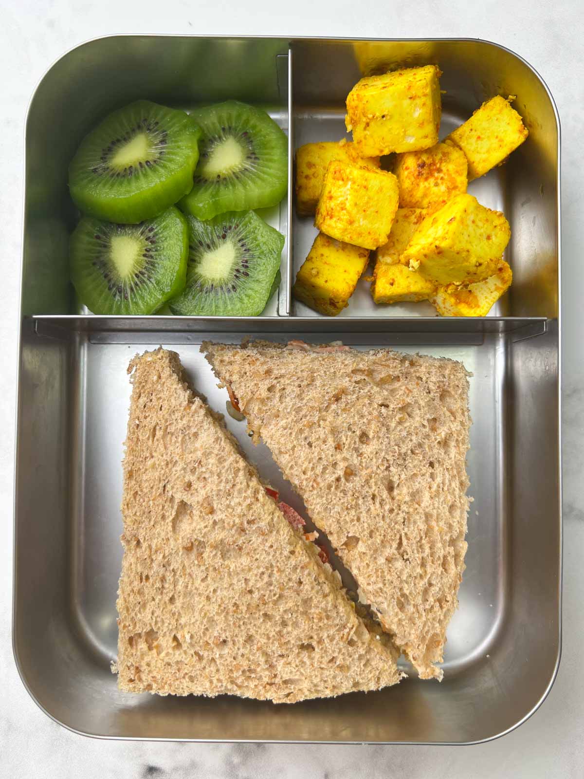 kids school lunch box idea veg mayo sandwich, paneer and kiwi