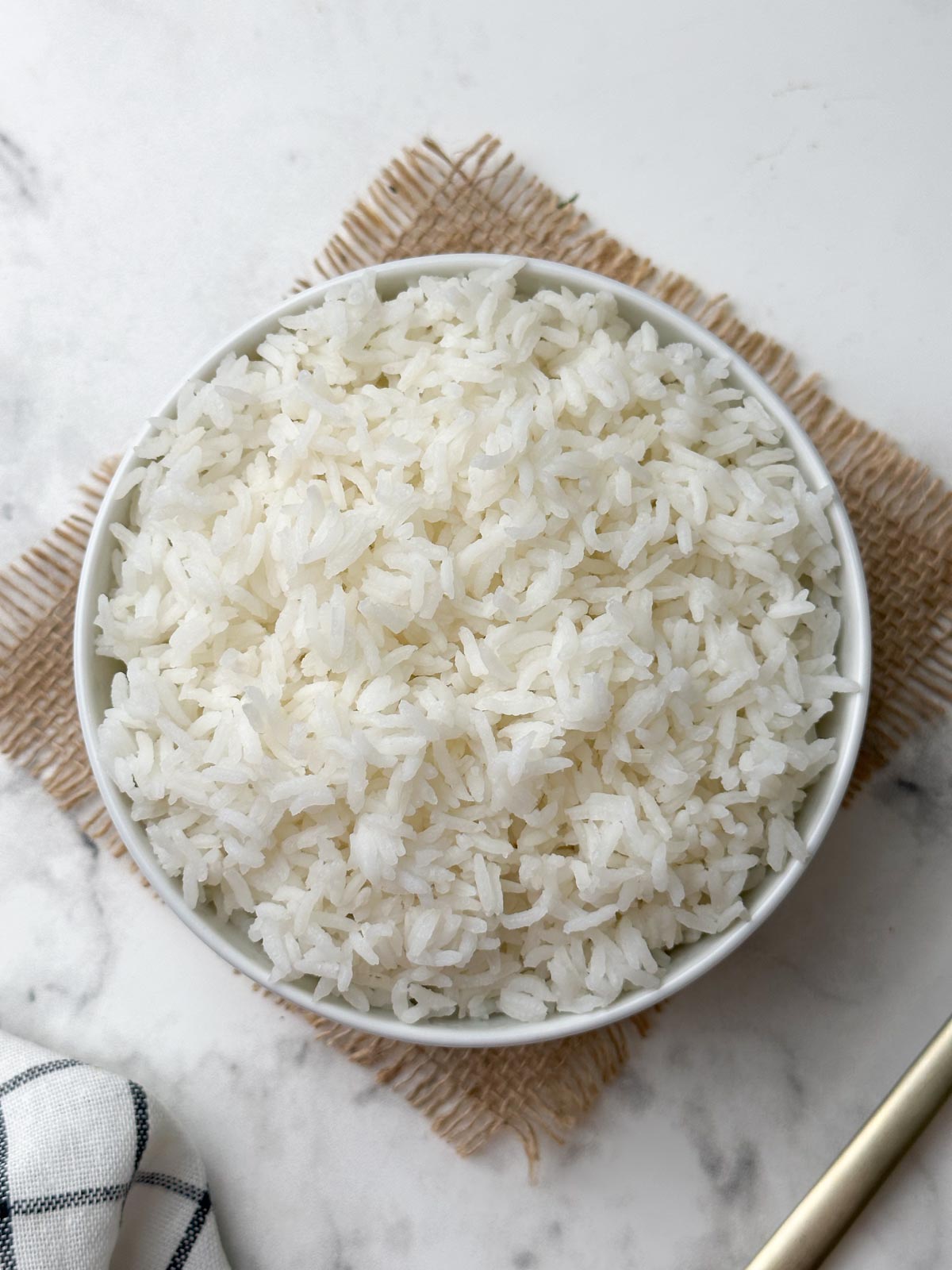 cooked instant pot sona masoori rice in a white bowl