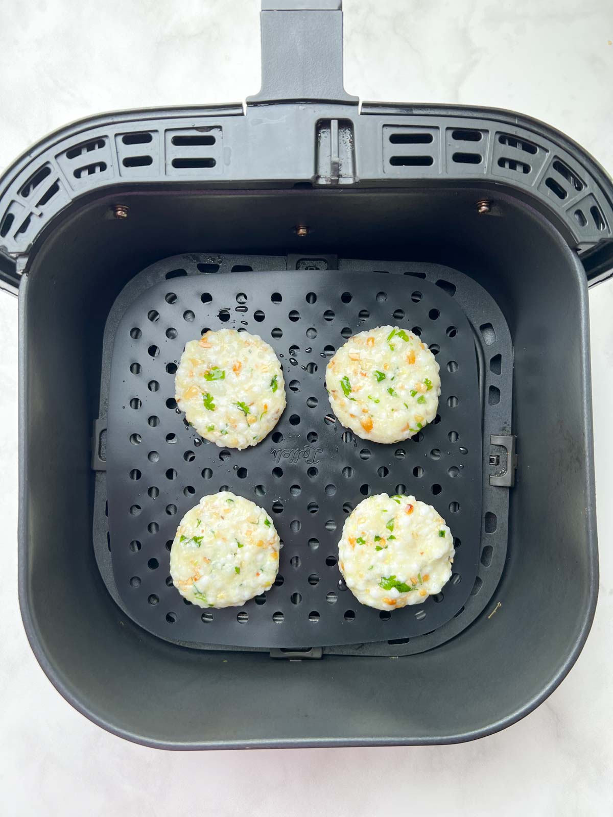 step to place the sabudana vada to air fryer