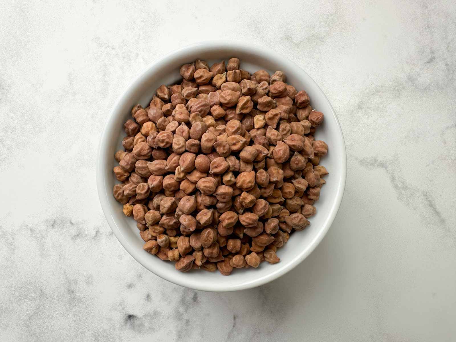 dried black chickpeas (kala chana) in a bowl