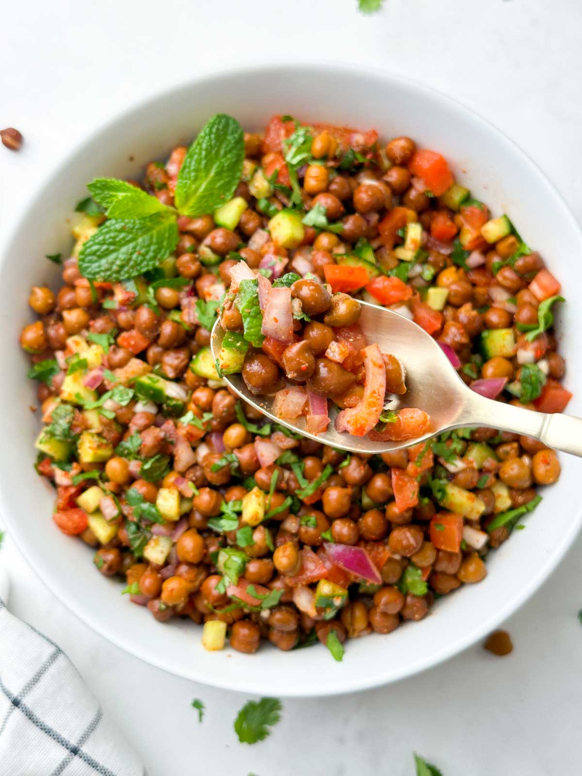 kala chana salad in a spoon