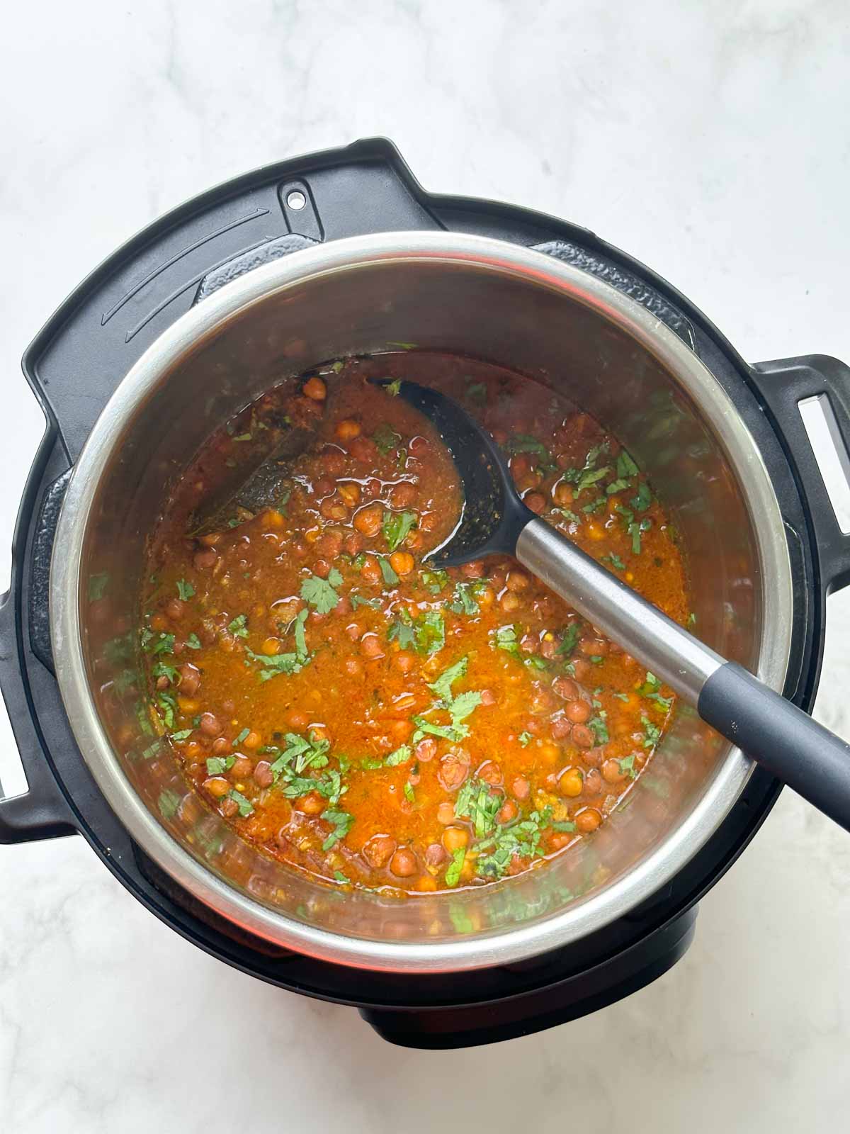 kala chana curry in the instant pot with spoon