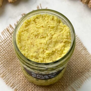 ginger paste in a glass jar with ginger knob on the side