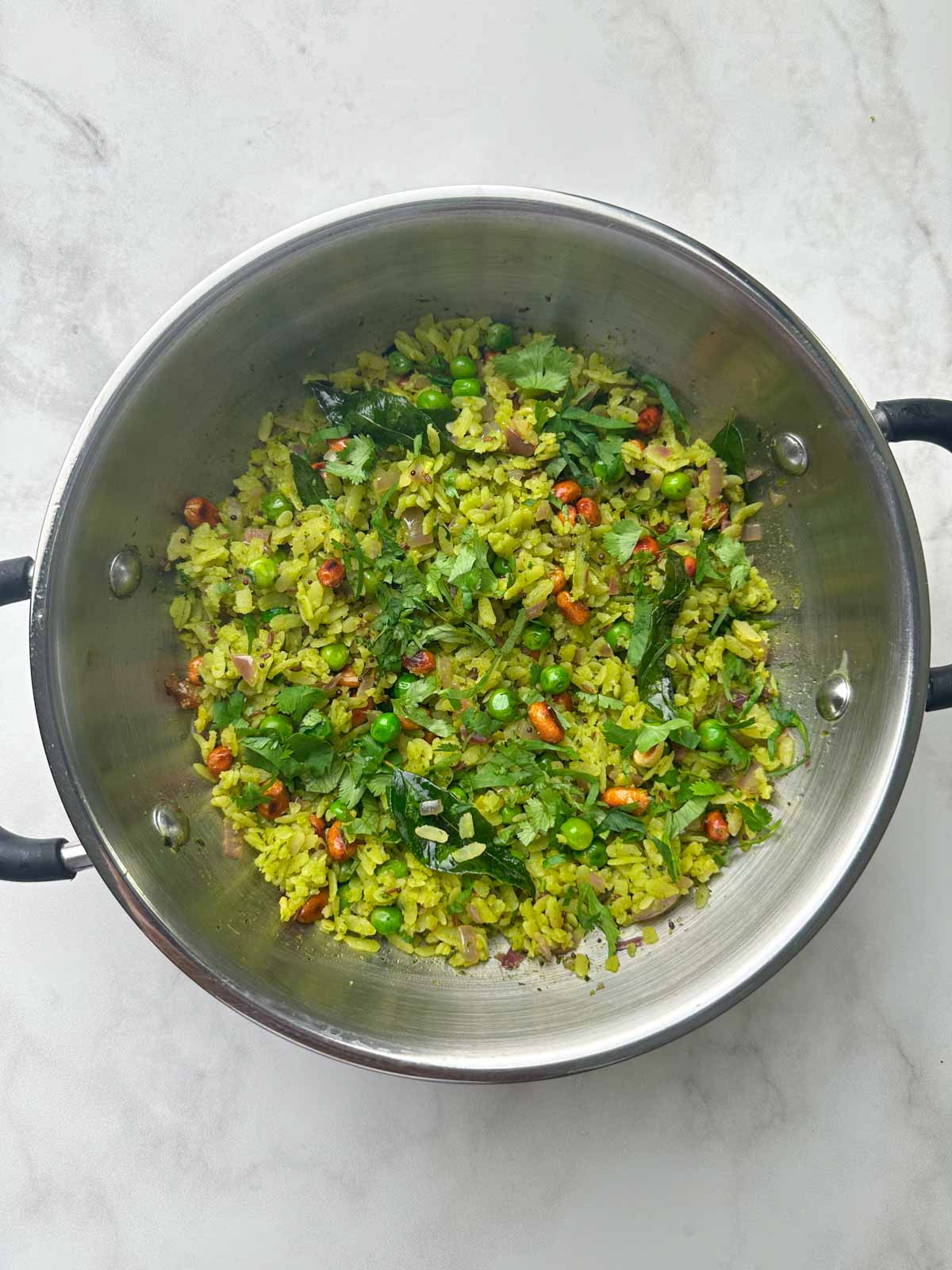 green masala poha (hariyali poha) in a kadai