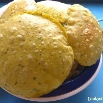 Methi poori served in a bowl with pickle on the side