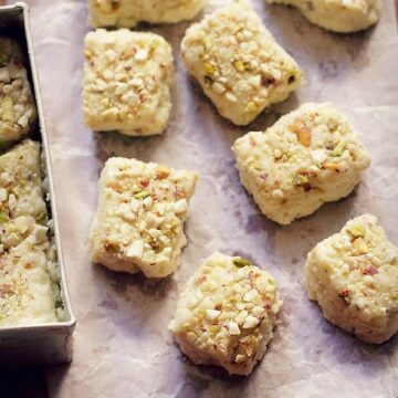 kalakand sweets on the parchment paper and few in the mould