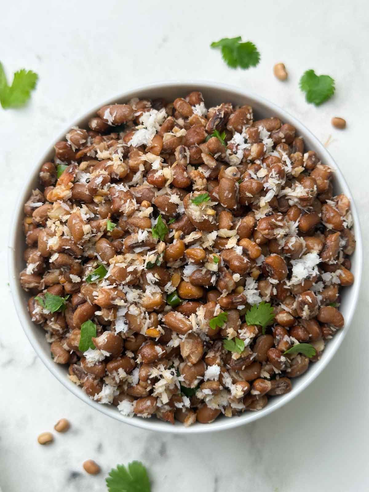 red chori sundal (adzuki beans sundal) recipe served in a bowl garnished with coriander leaves