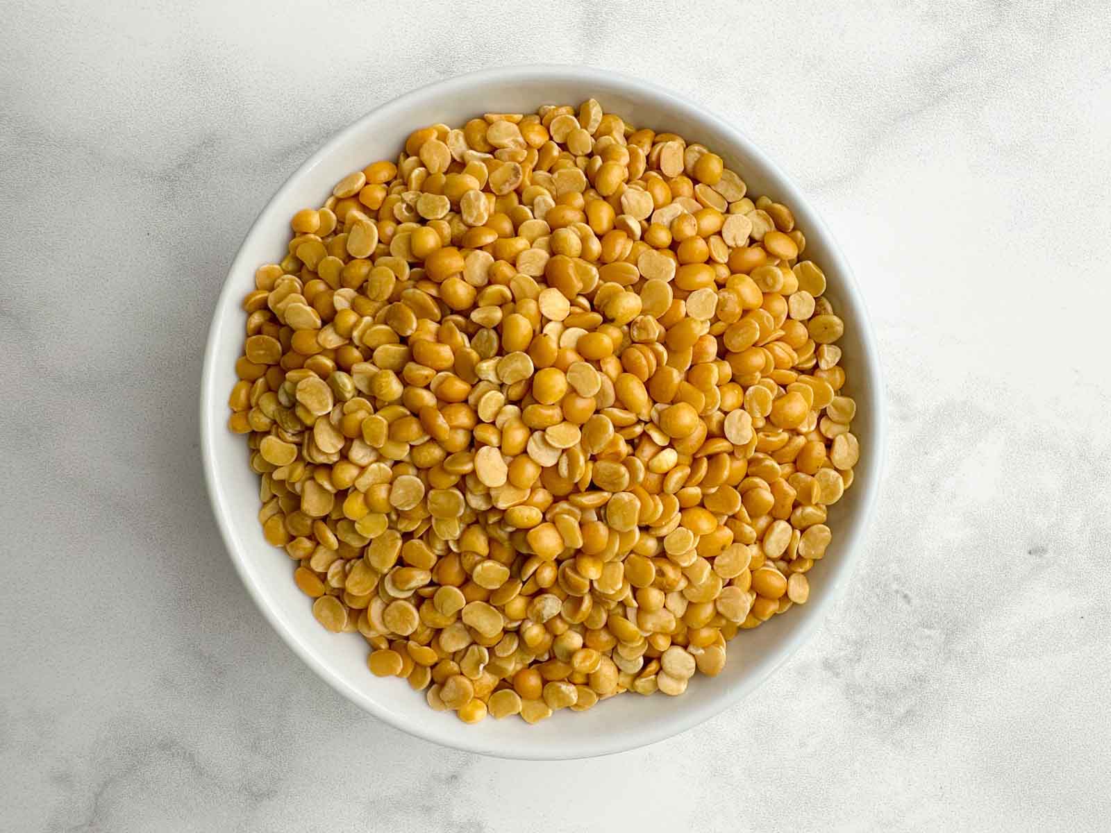 toor dal in a white bowl