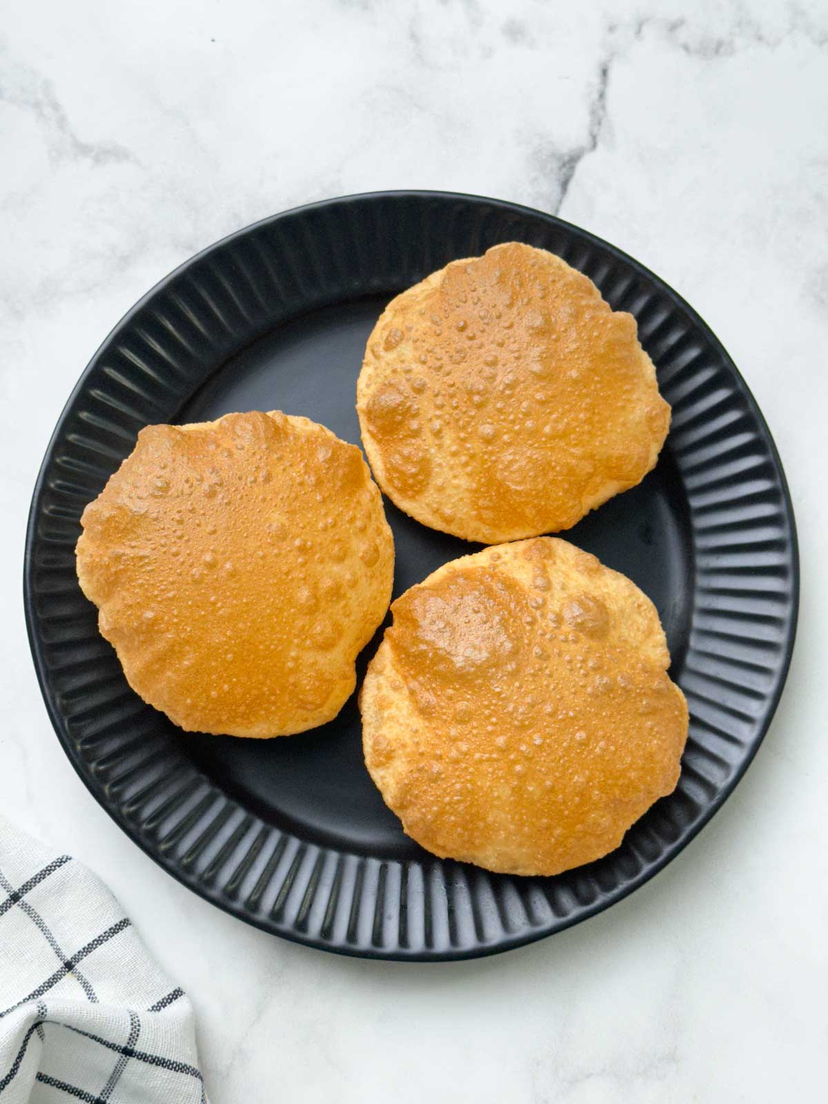 crispy and puffy three puri served on a plate