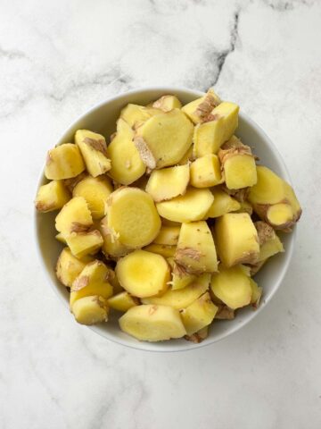 peeled and sliced ginger in a bowl