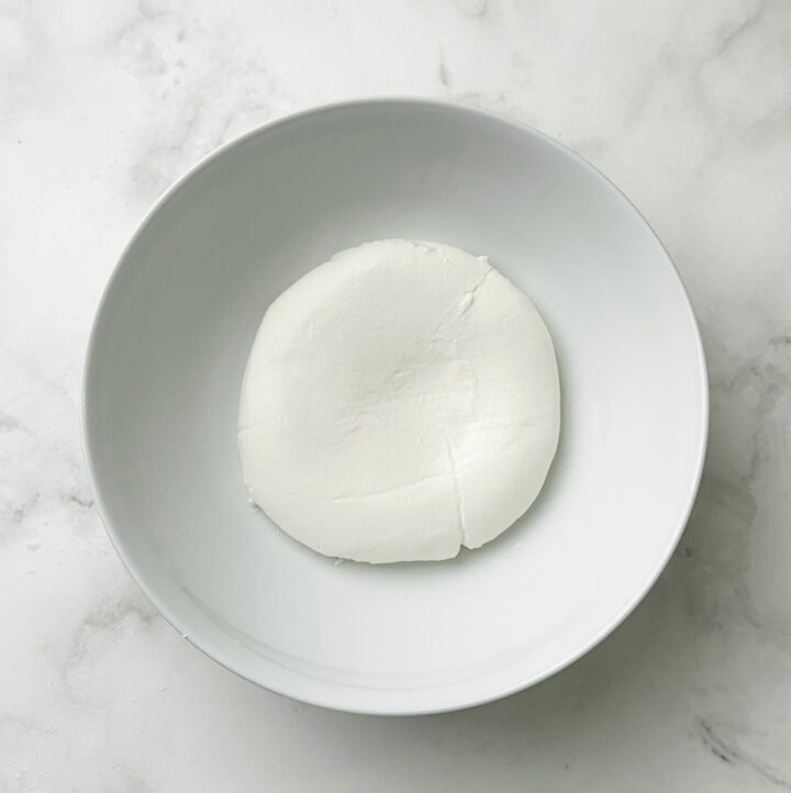 hung curd in a white bowl