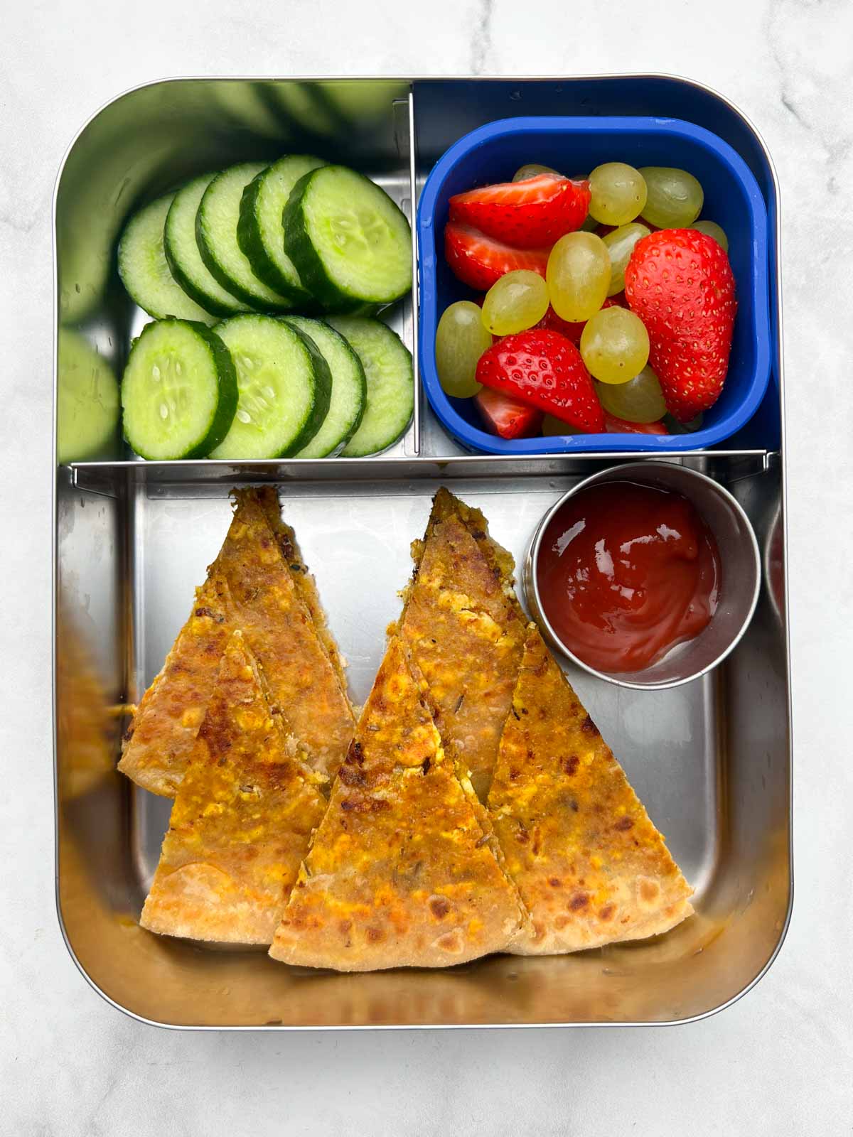 kids lunch box paneer paratha with cucumber and fruits