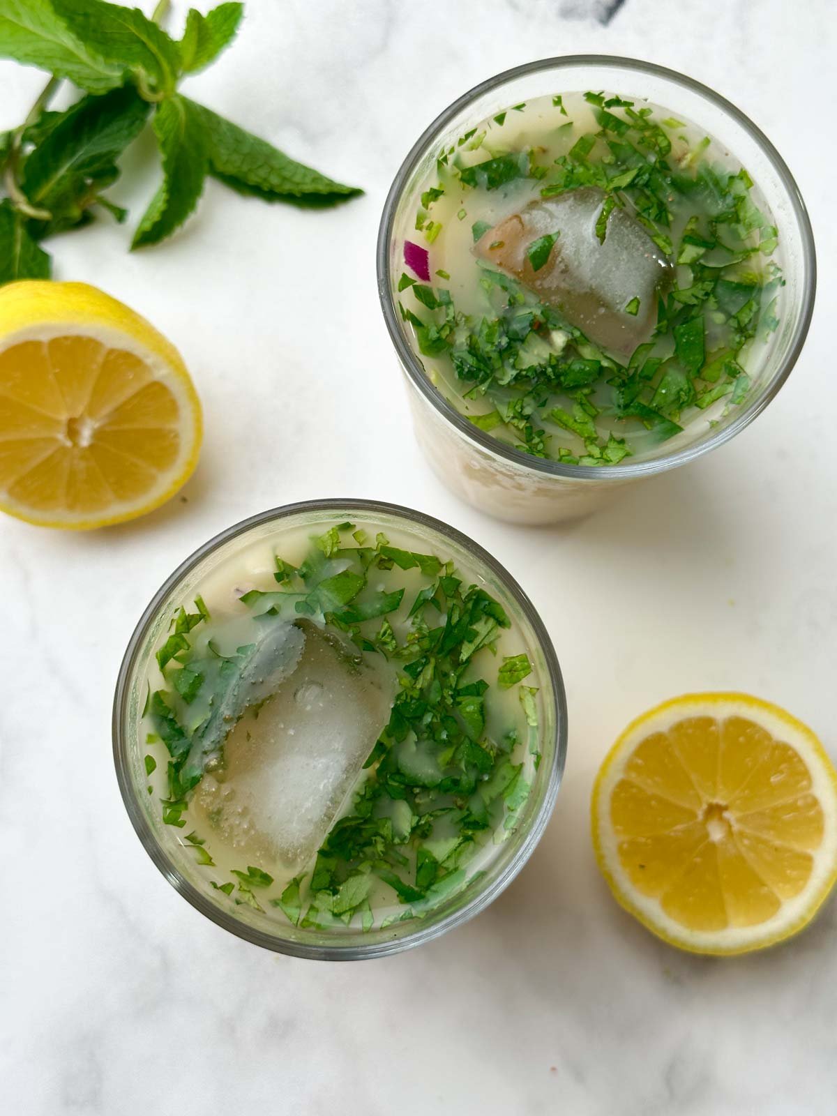 sattu Drink recipe served in a tall glass garnished with mint and lemon on the side