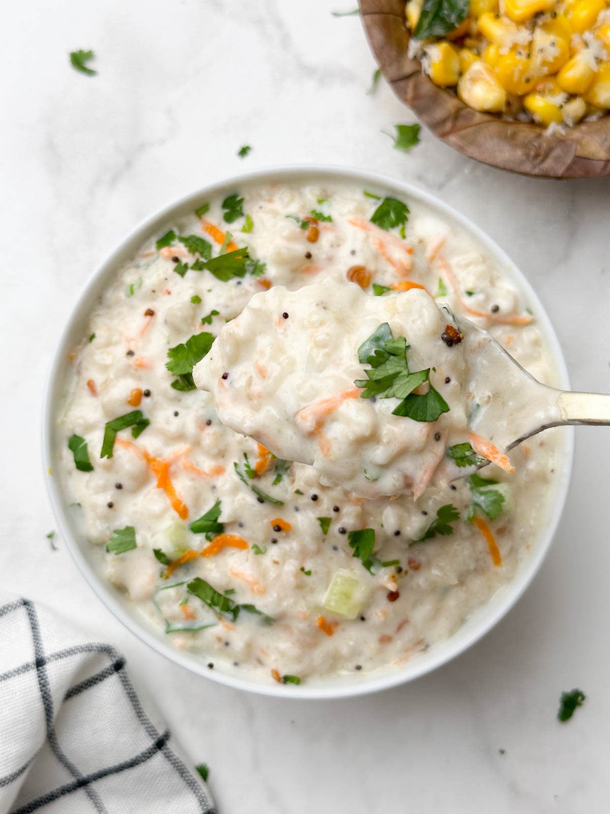 spoon of curd oats in a bowl