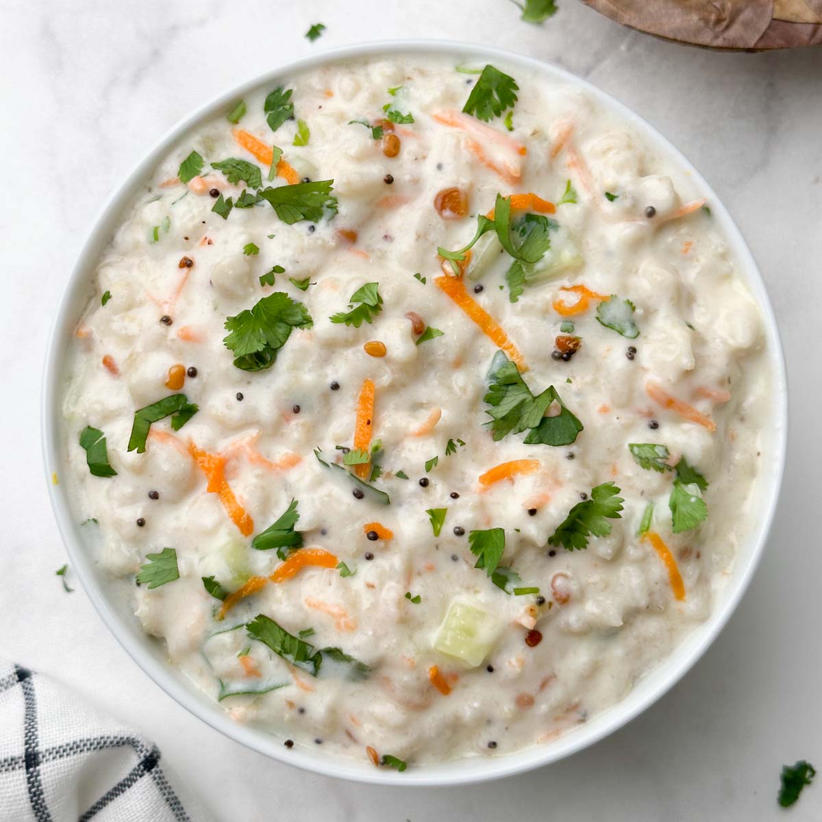 curd oats served in a bowl with corn sundal on the side