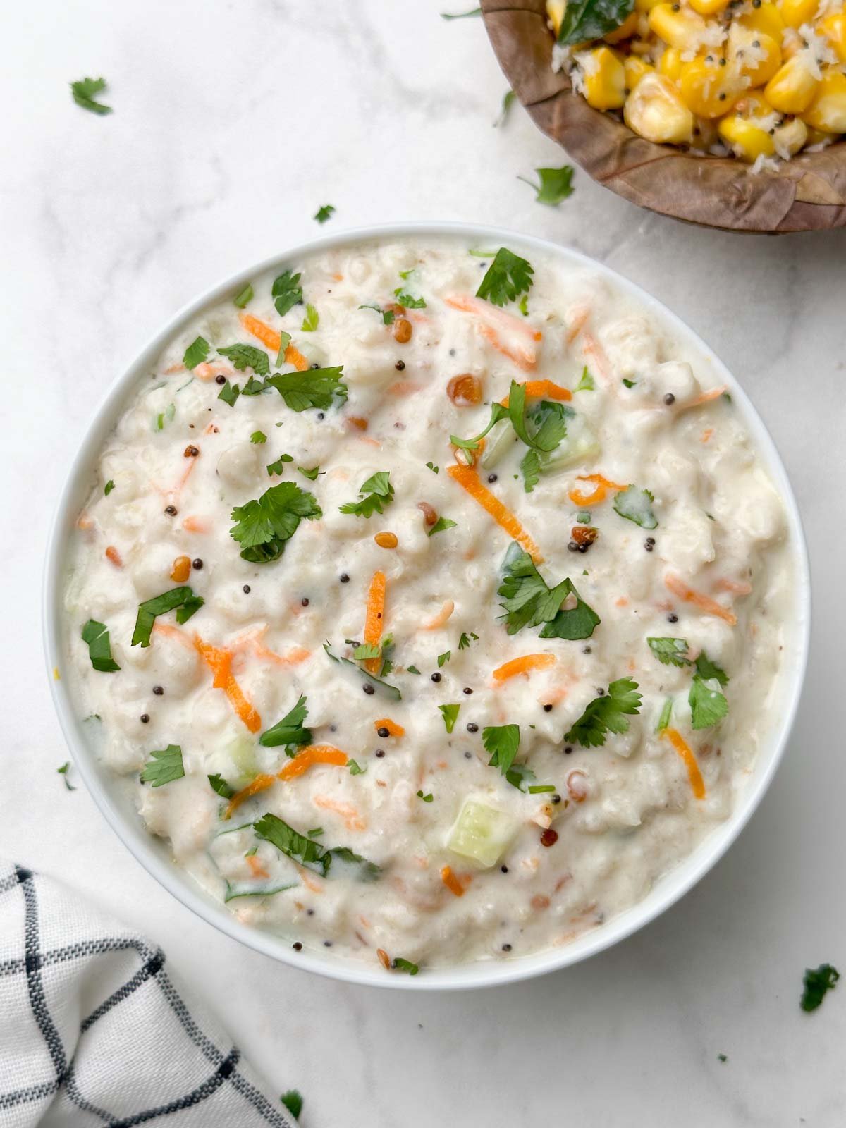 curd oats served in a bowl with corn sundal on the side