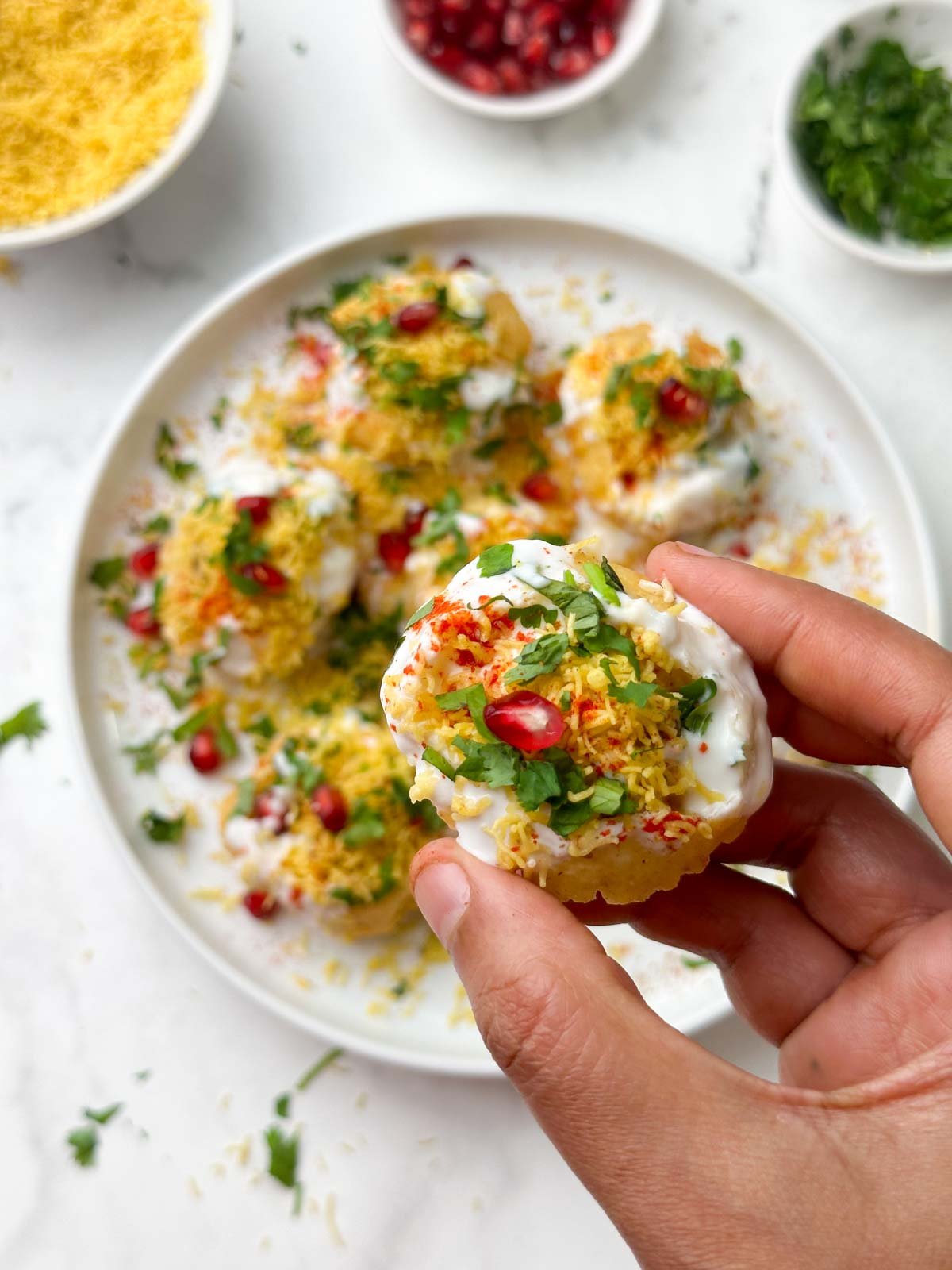 dahi batata sev puri in hand