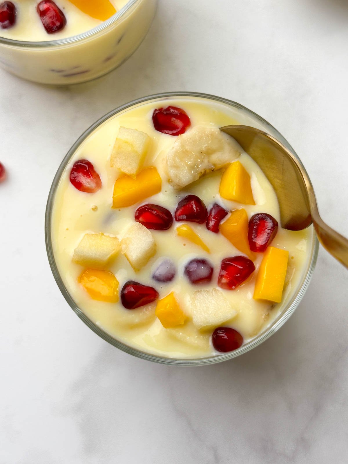 Dessert served in 2 glass bowls with a spoon