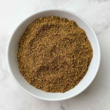 Garam masala spice blend in a white bowl.