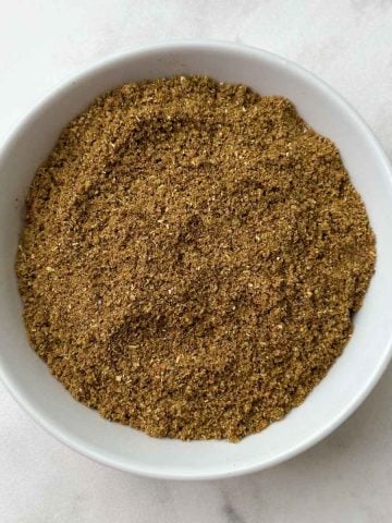 Garam masala spice blend in a white bowl.