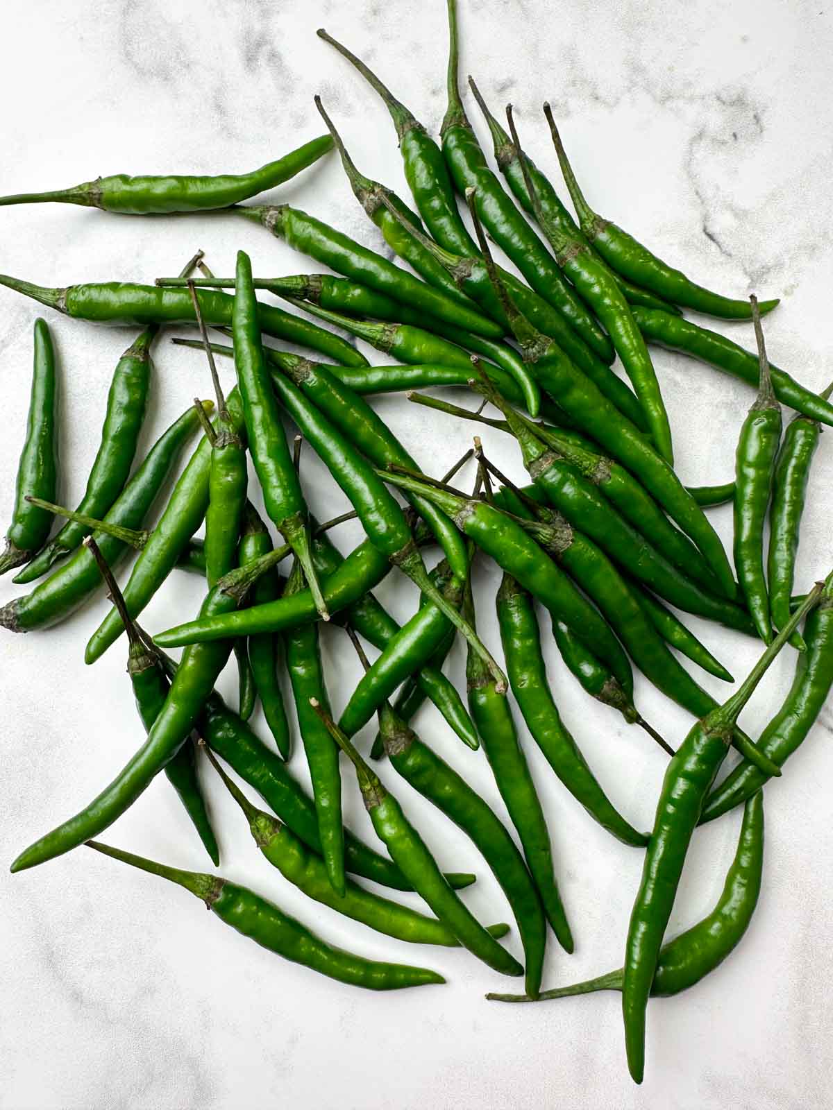  indian green chilies on the board