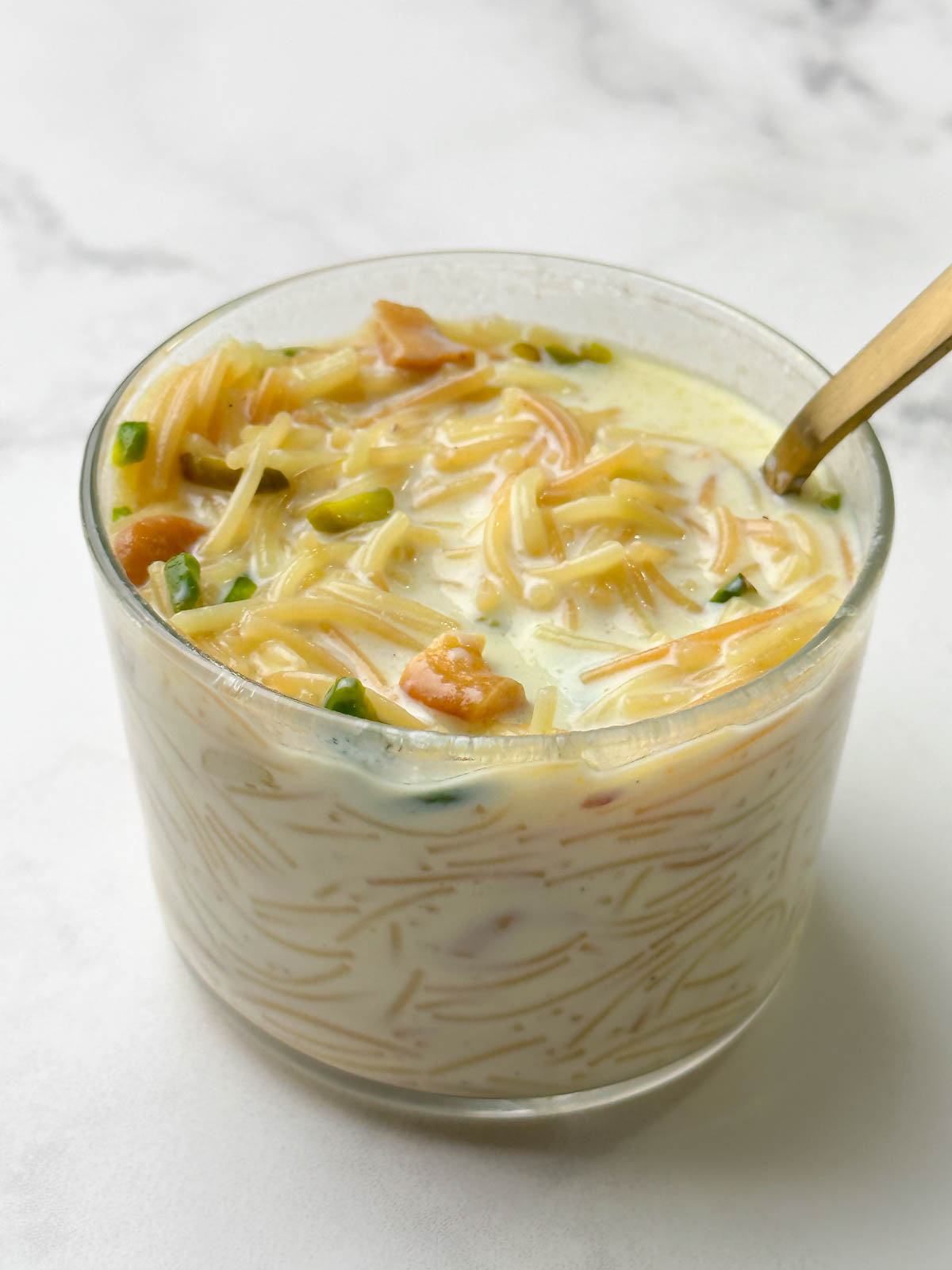 semiya payasam/kheer served in a glass bowl with a spoon