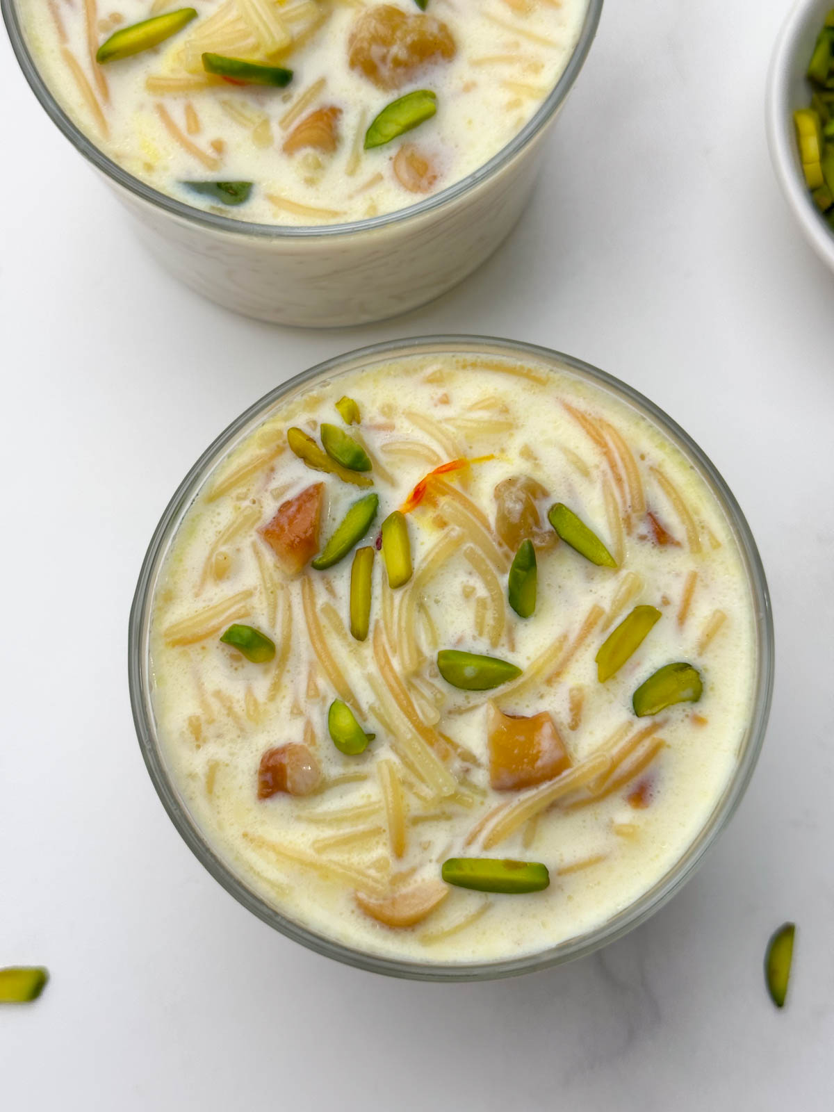 vermicelli kheer (semiya payasam) served in a bowl and pista on the side
