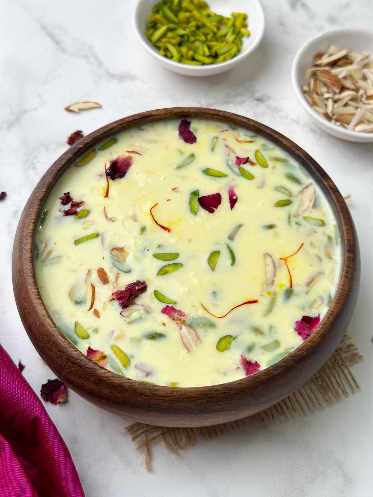 paneer kheer (paneer payasam) recipe served in a bowl with nuts on the side