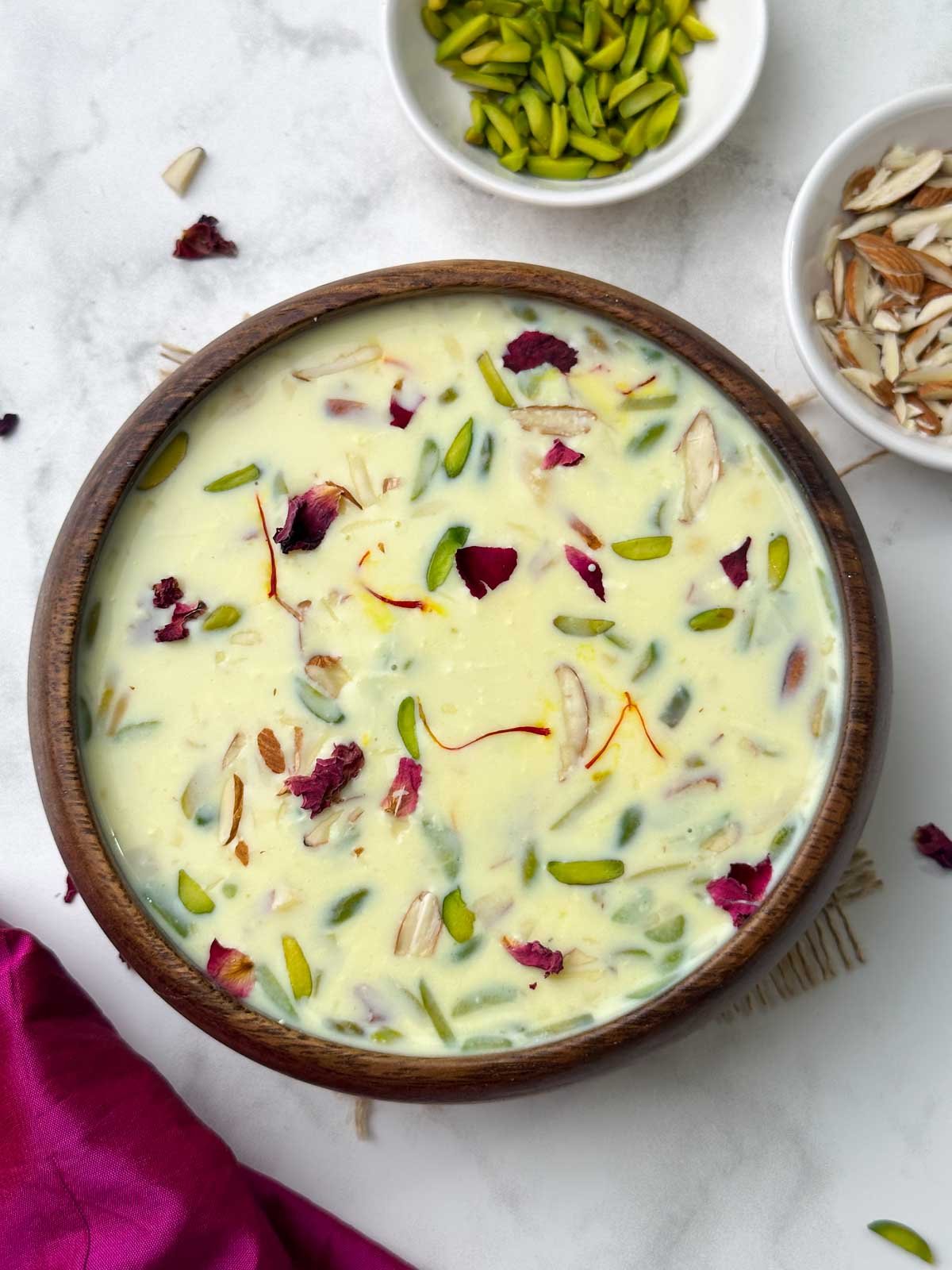 paneer kheer (paneer payasam) served in a bowl with nuts on the side