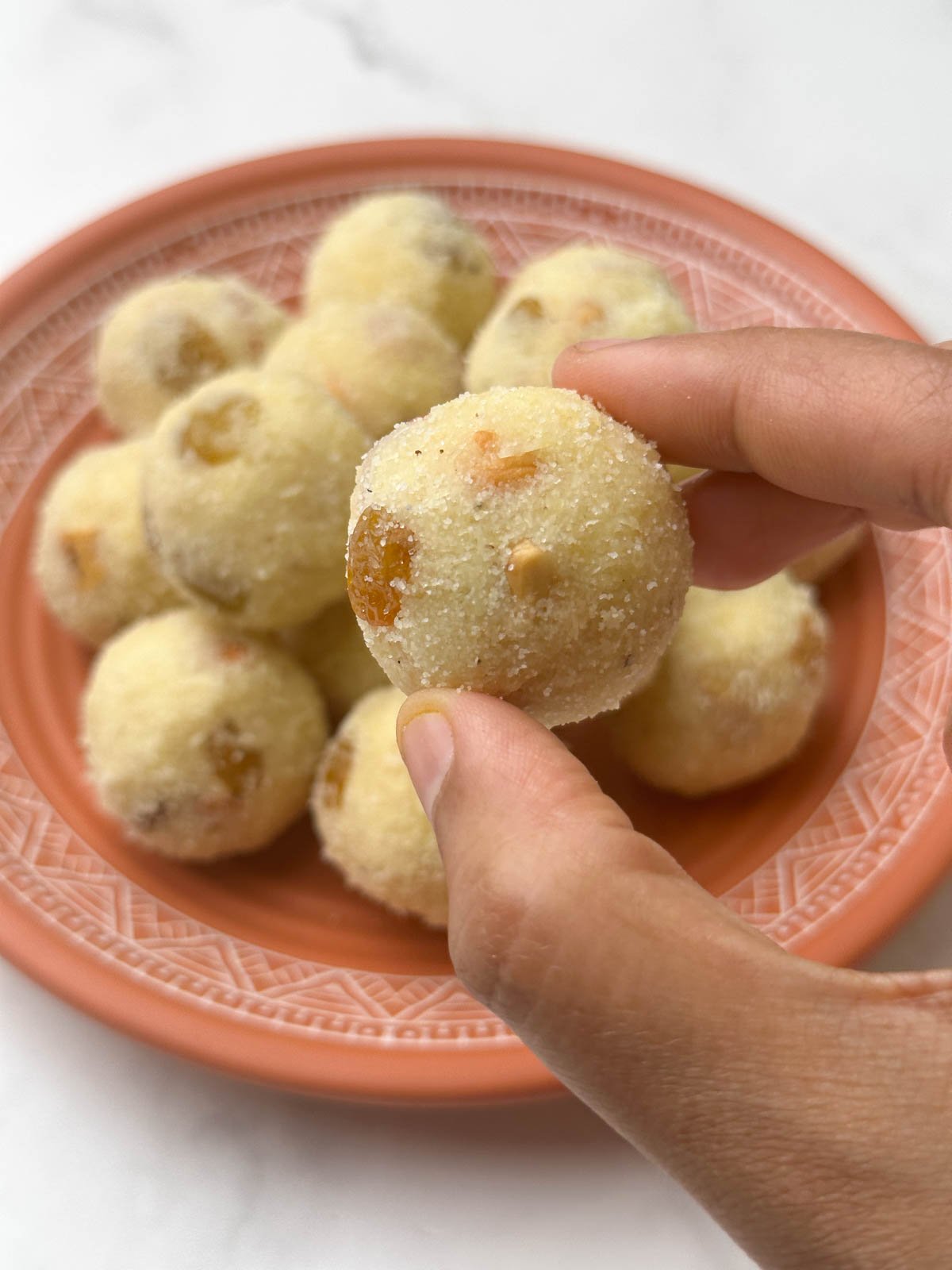 rava ladoo in hand