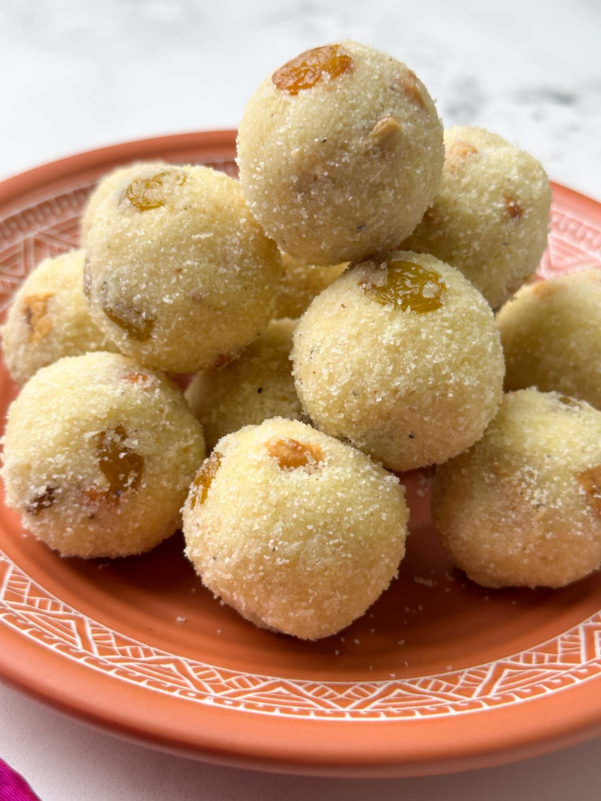 rava ladoo stacked on a plate