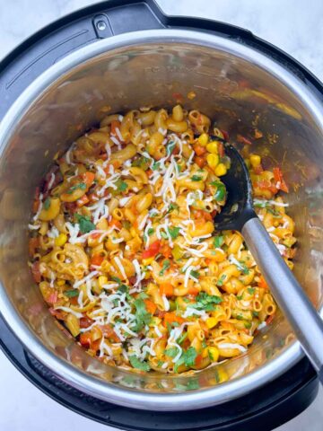 masala pasta in the instant pot with a ladle