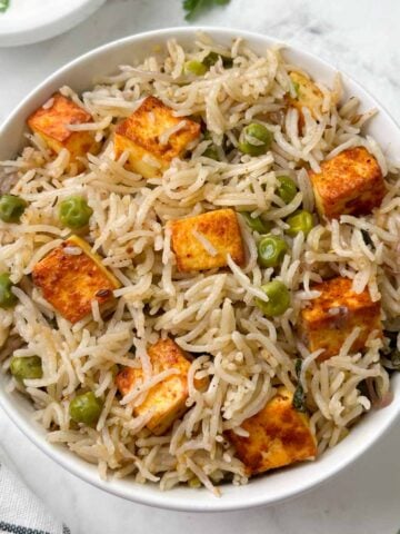 paneer peas pulao in a serving bowl