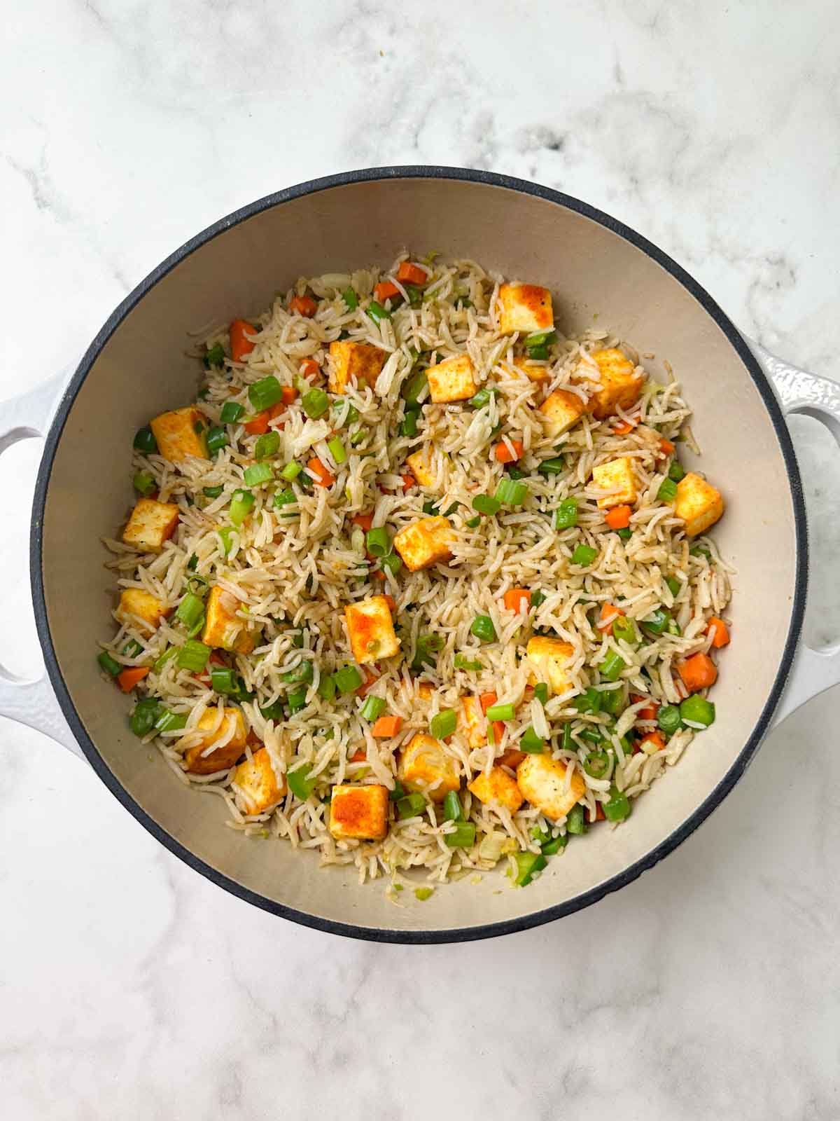 indian style paneer veg fried rice in a dutch oven