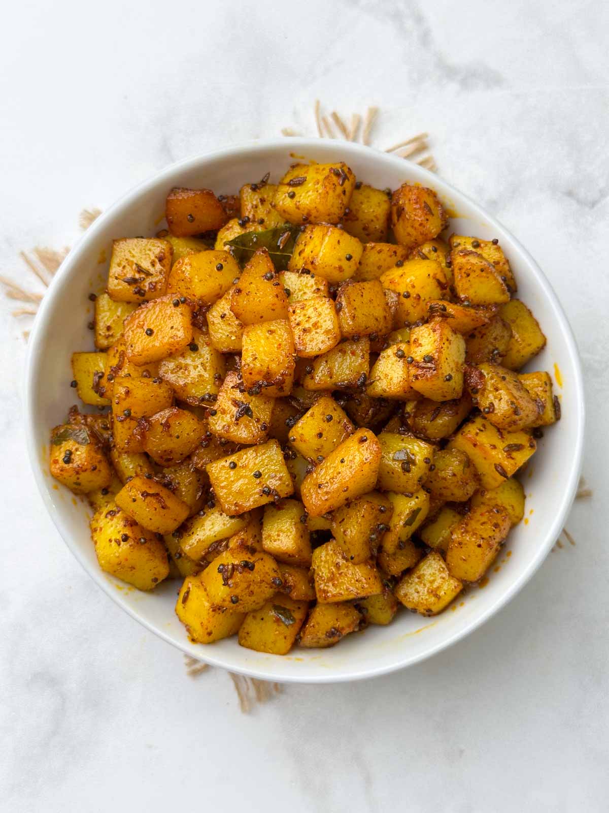 potato (aloo) fry recipe served in a bowl