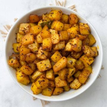 south indian potato fry served in a bowl