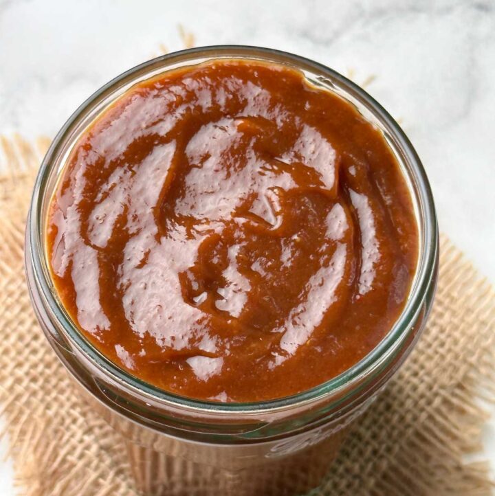 sweet tamarind date chutney in a glass jar