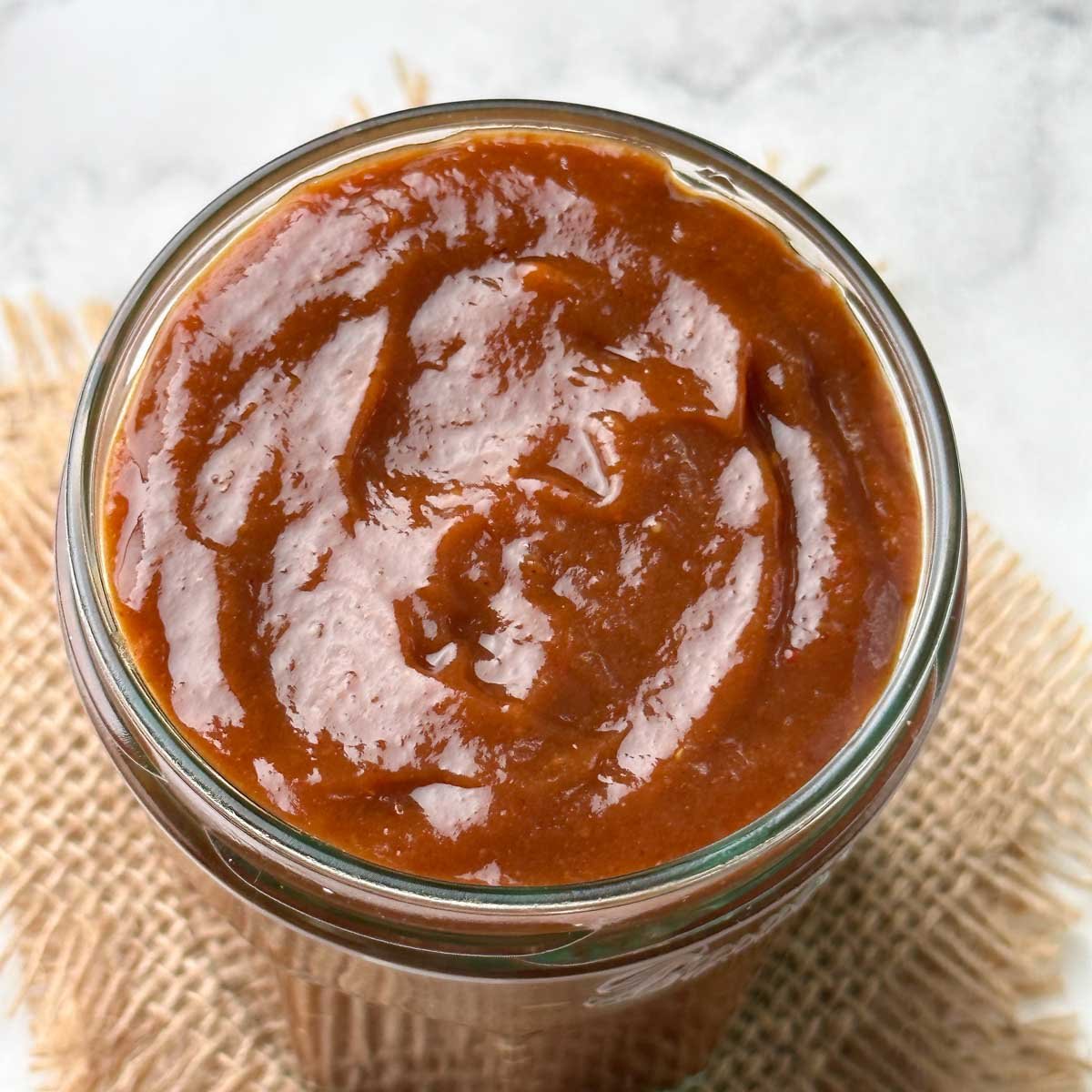 sweet tamarind date chutney in a glass jar