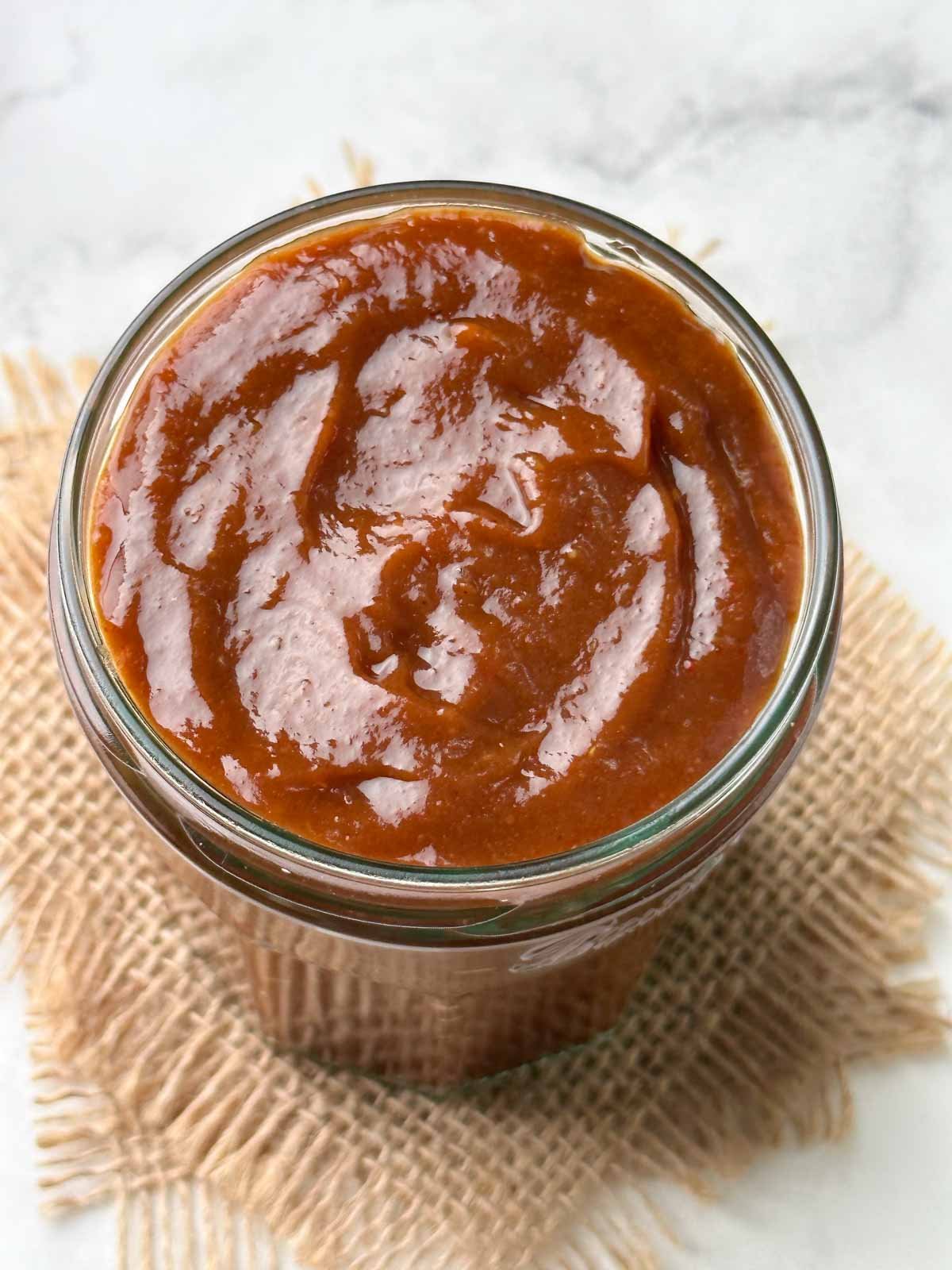 sweet tamarind date chutney in a glass jar