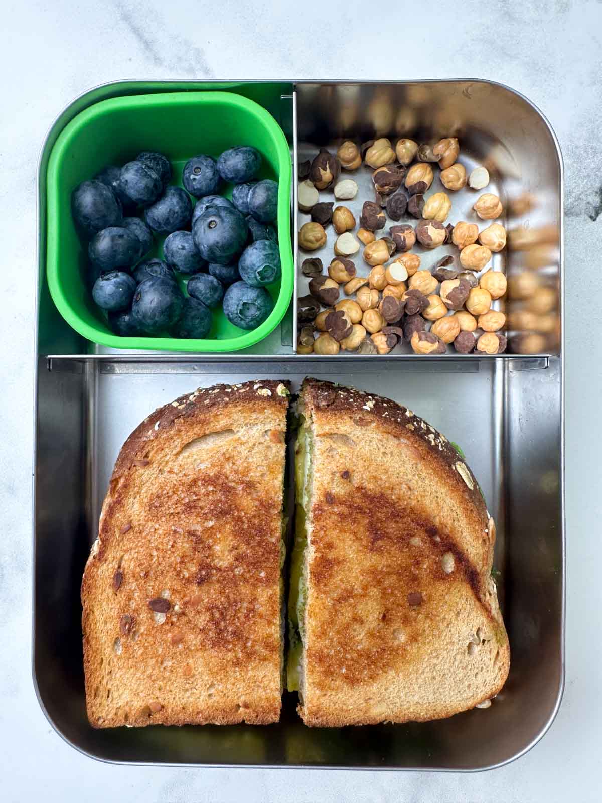 avocado chutney sandwich, roasted chana and blueberries in bento steel lunch box