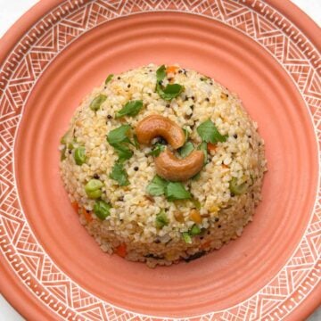 dalia upma (broken wheat upma) recipe served in a plate