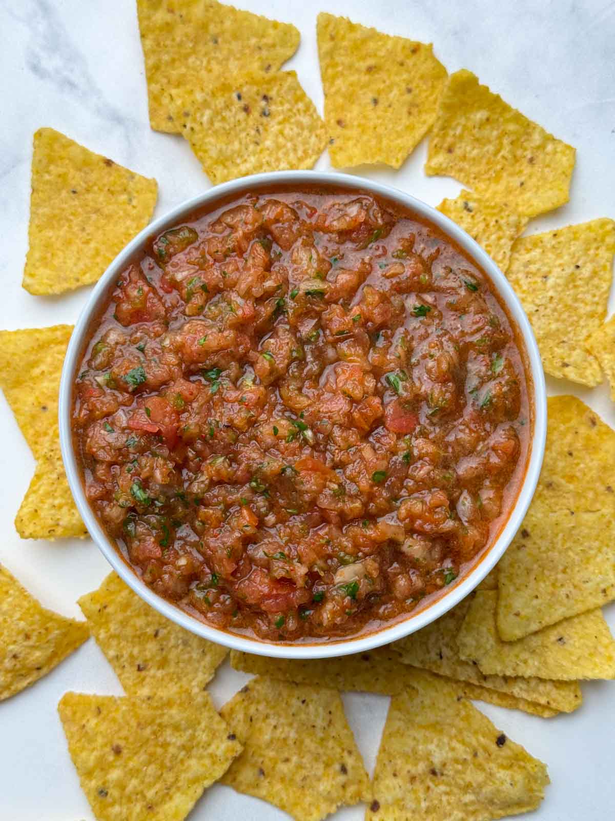 dip served in a bowl with tortilla chips on the side