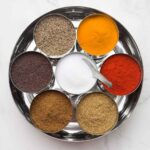 indian spices in a steel spice box