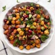 roasted chana salad served in a white bowl.
