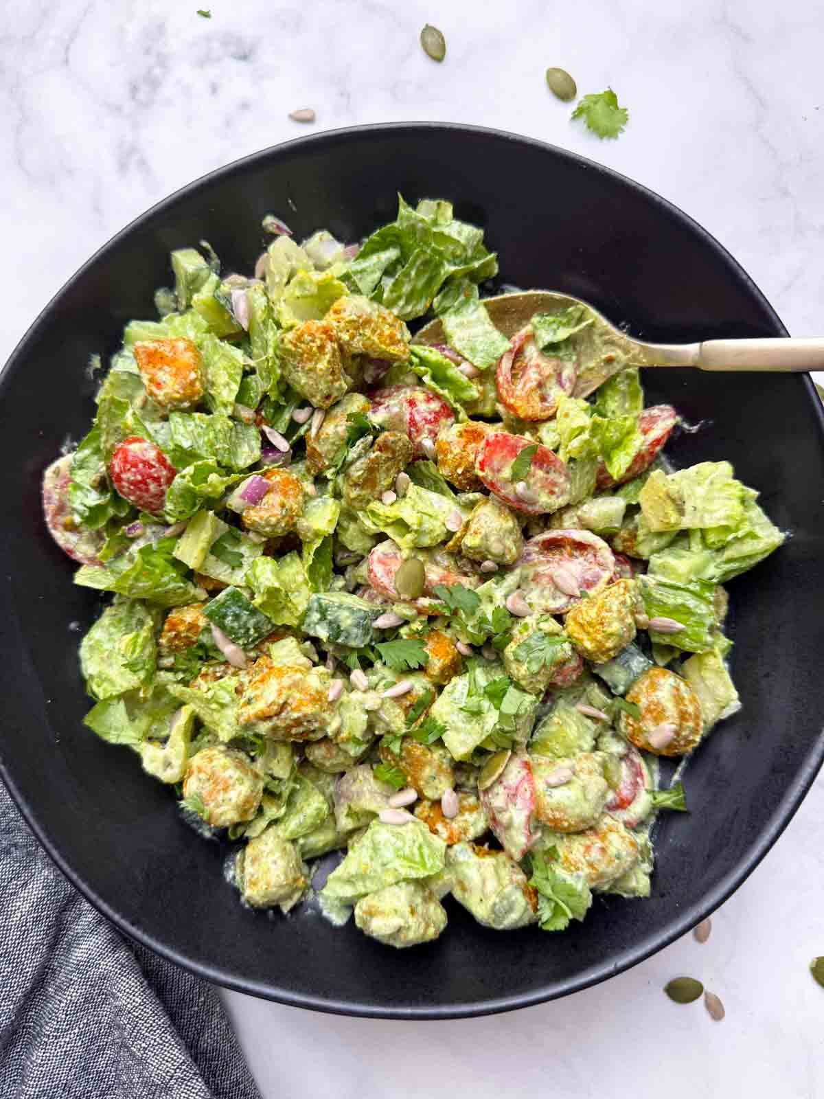 Soya chunks salad in a bowl with a golden spoon on it.