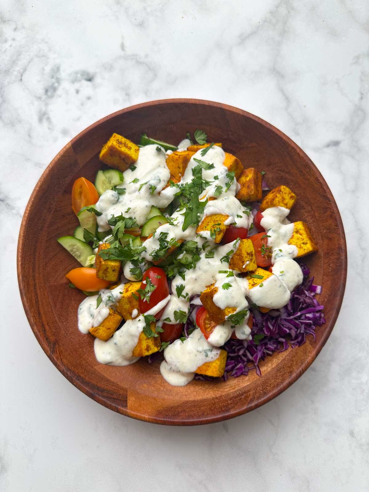 Greek yogurt dressing tossed on the veggies and tofu.